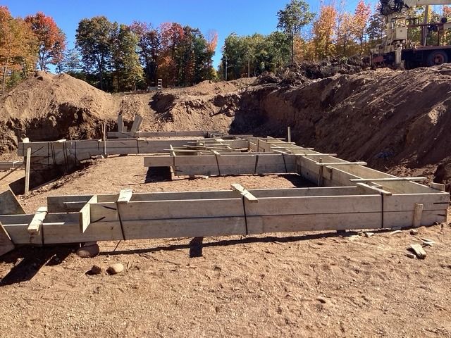 Footing forms set in a deep house excavation
