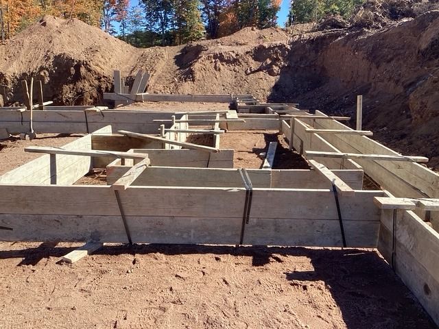 Footing forms set in a house excavation