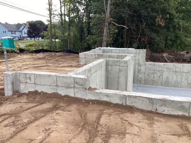 Concrete foundation with the ground graded around it