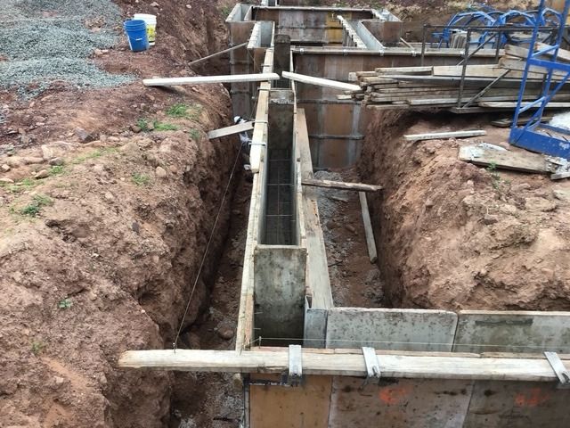 Foundation wall forms set in a trench